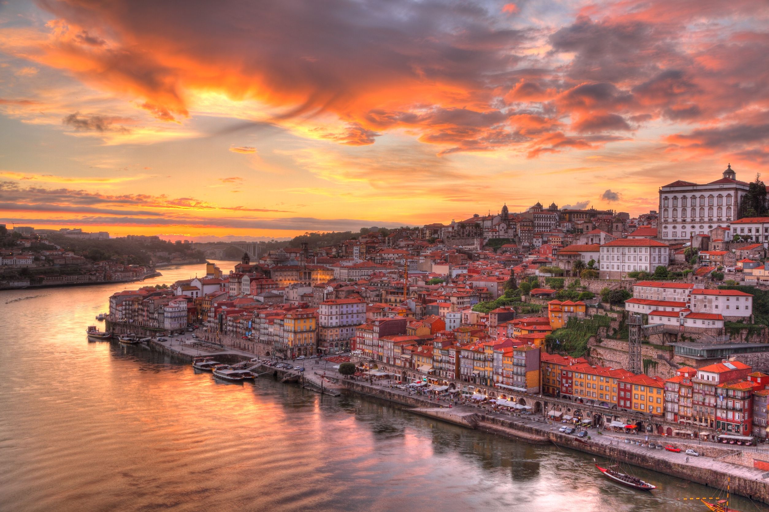 9989615 - panorama old city porto at river duoro,with port transporting boats at sunset,  oporto, portugal