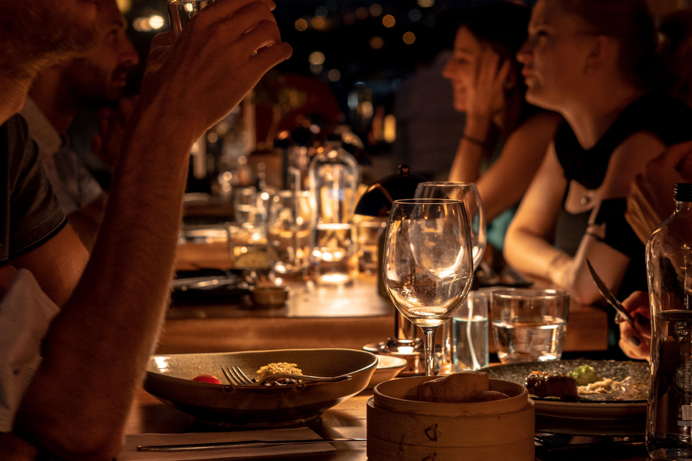 Guests enjoying a luxury dining experience aboard