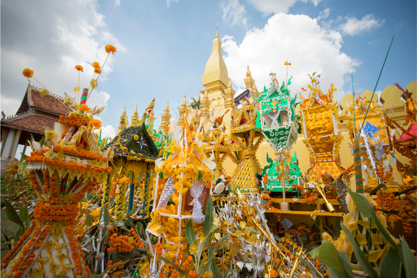 Traditional Phasat Pheung wax towers showcased during Boun That Luang in Vientiane