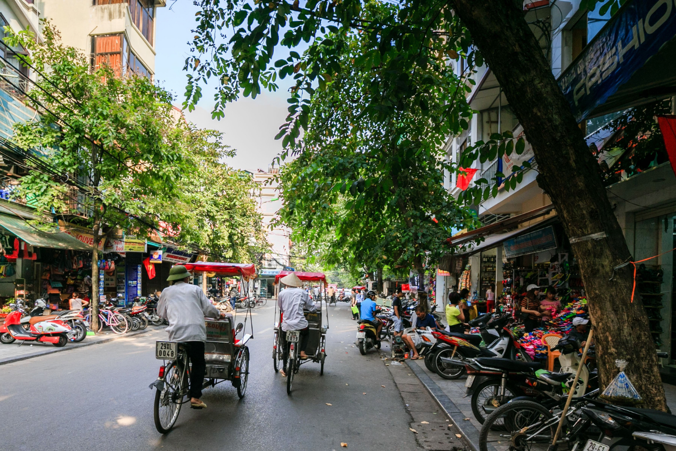 A traditional cyclo tour offers a peaceful glimpse into vibrant Hanoi streets.