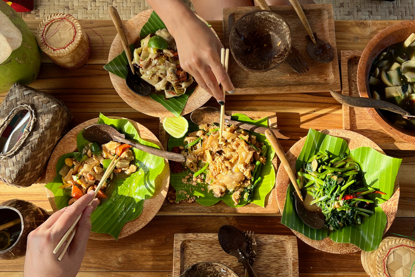 Premium FIT: Lao dishes served on banana leaves and wooden platters