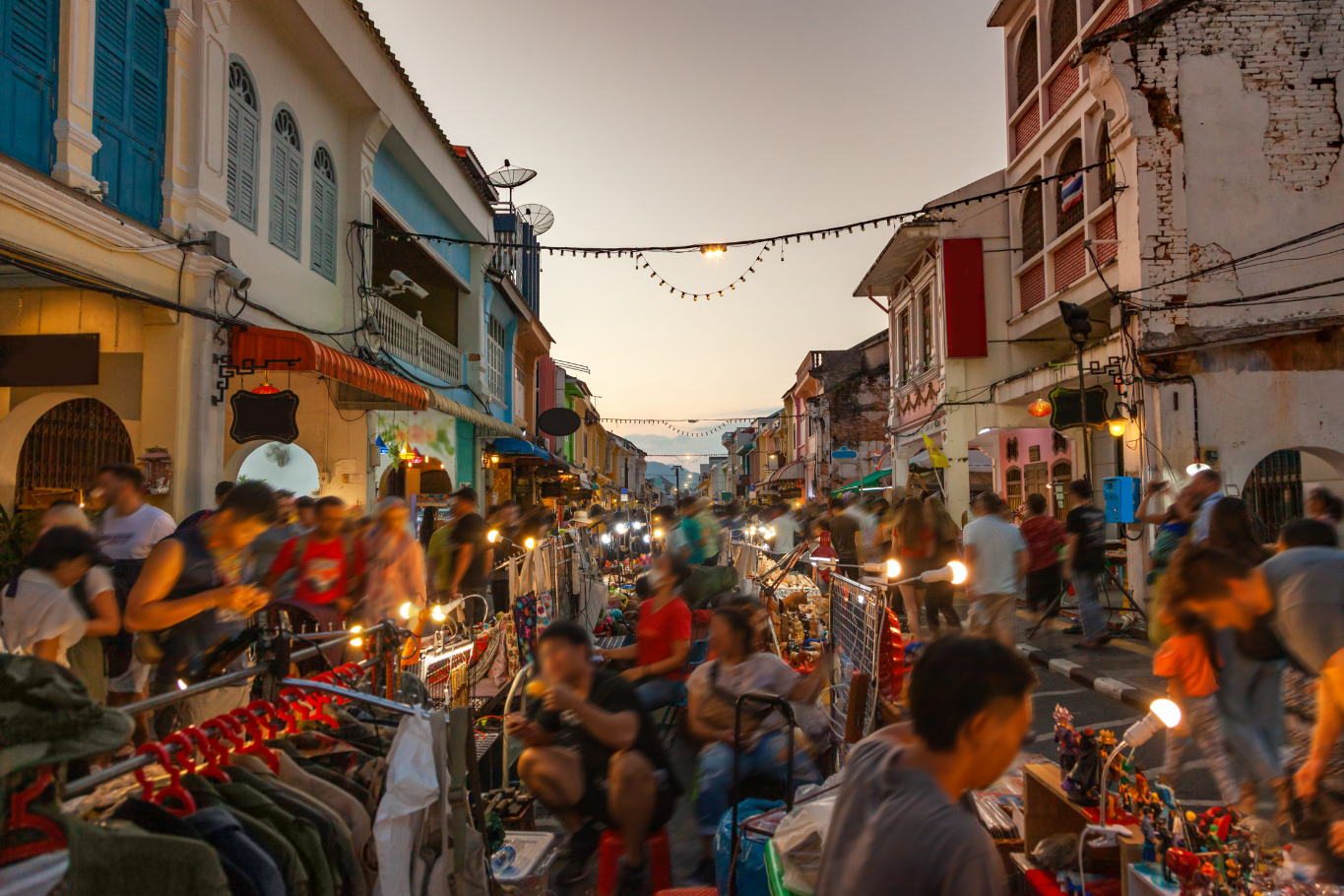 Tourists exploring Old Town street market in Phuket