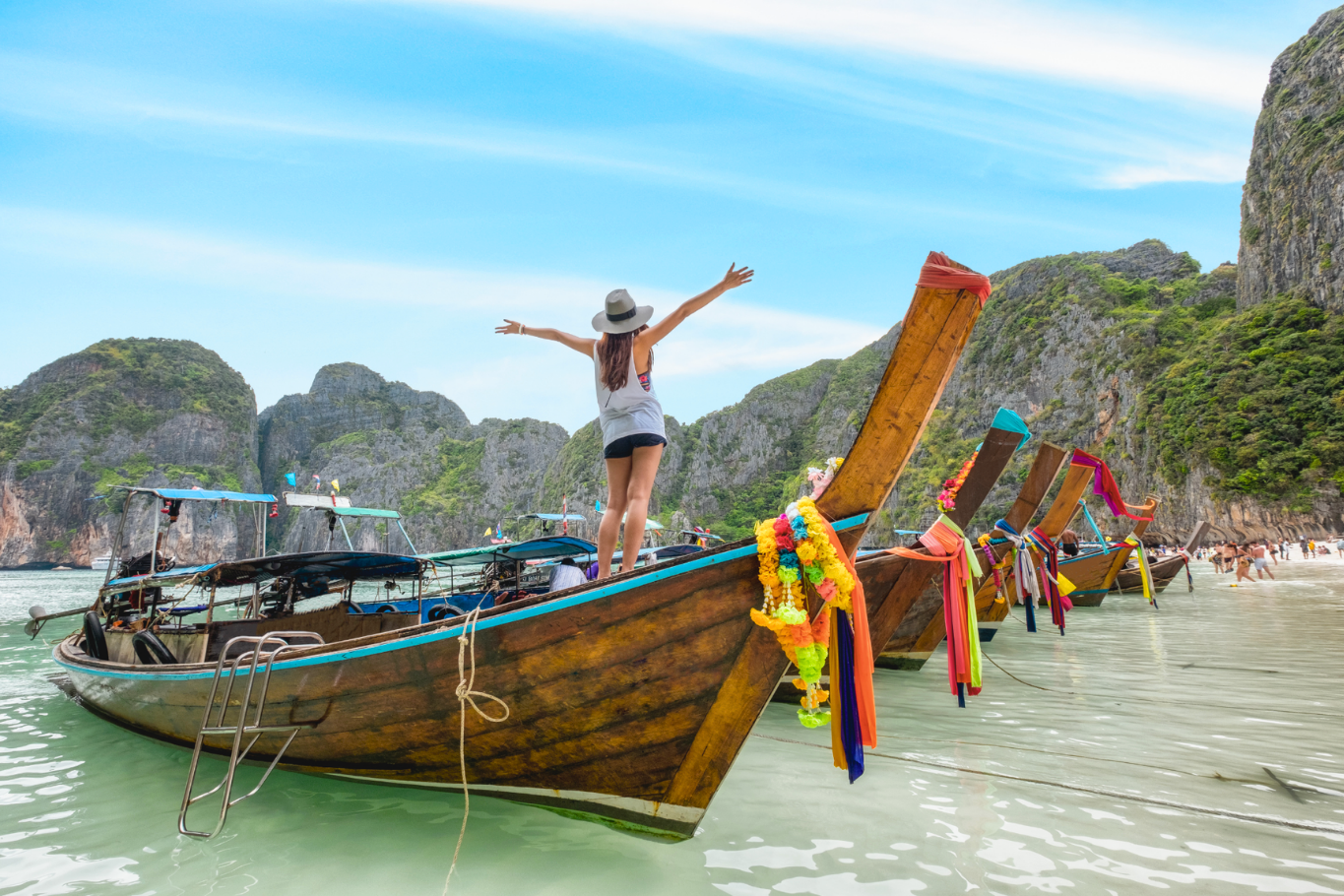 Traveler on a traditional longtail boat
