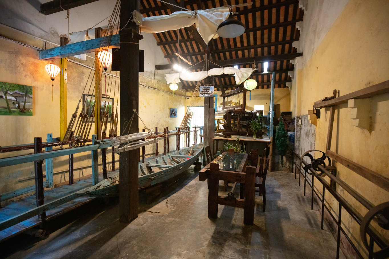 Interior of a museum featuring historical crafts and antique wooden tools.