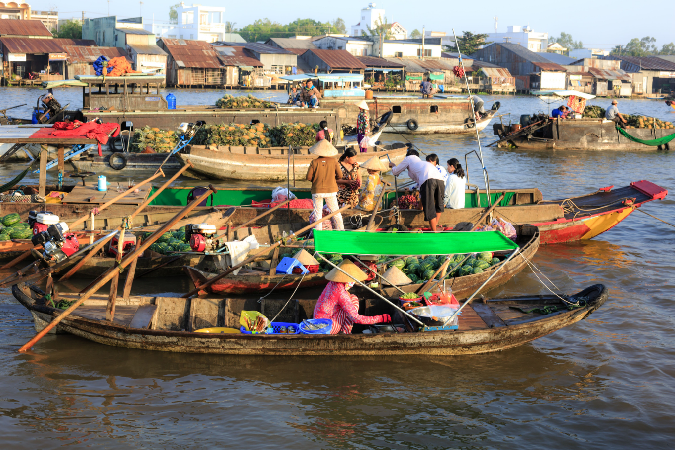 Bustling floating market in Mekong Delta
