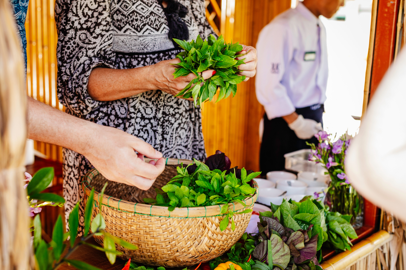 Fresh herbs and spices basket representing fragrant aromas of The Senses of Vietnam